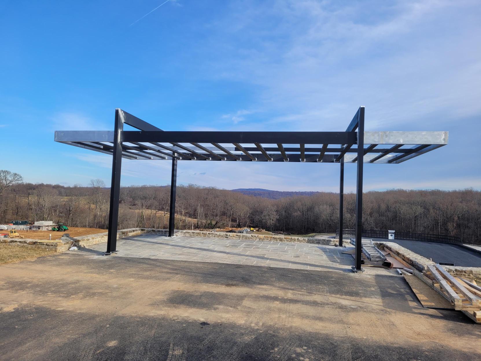 Commercial outdoor installation with custom pergolas and canopies