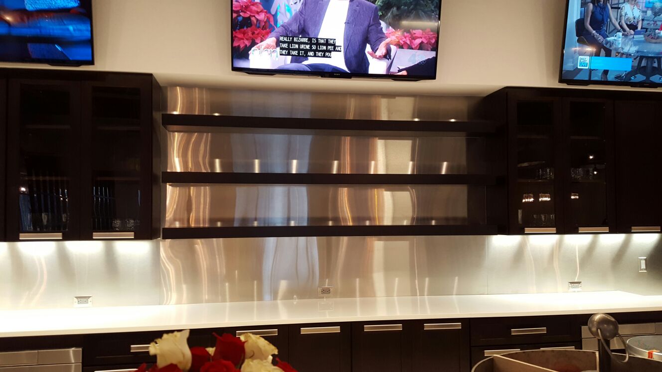 ANBIZA stainless steel countertop and backsplash with undercabinet lighting in a corporate pantry