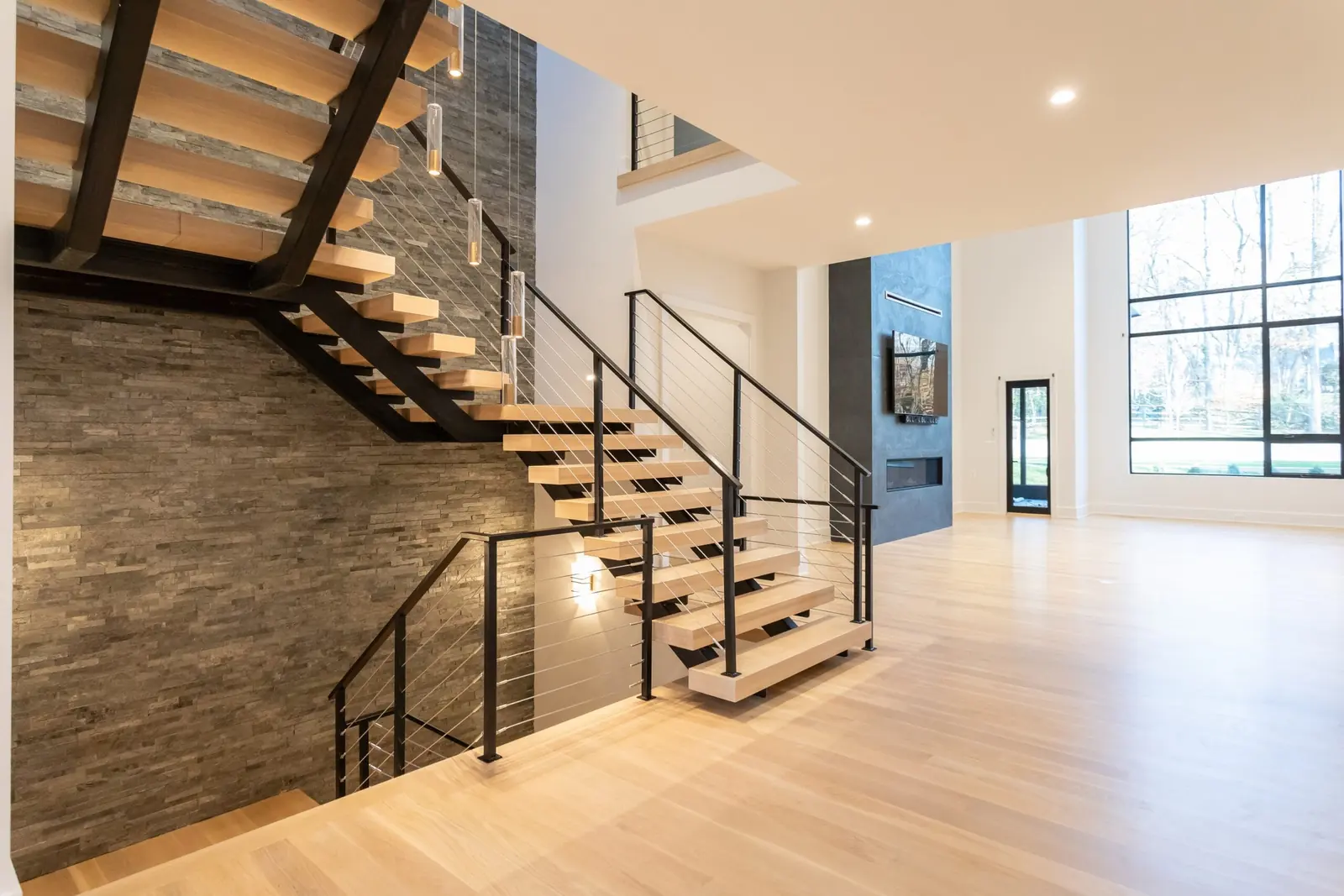 Residential renovation in McLean, VA featuring a double stringer stair with cable railing system